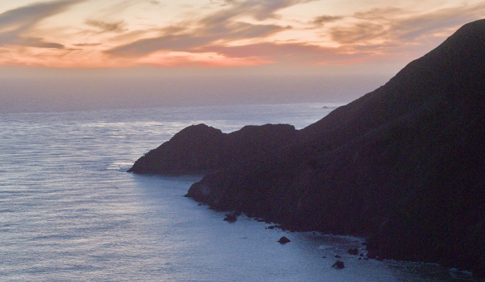 Coastal image with visible noise in dark underexposed shadows.